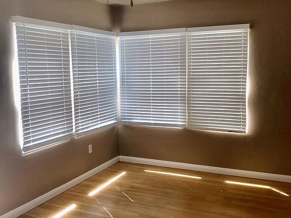 New faux wood shutters in entry room and all windows are double paned.