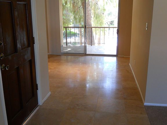 Dining Room and Balcony with Travertine Flooring
