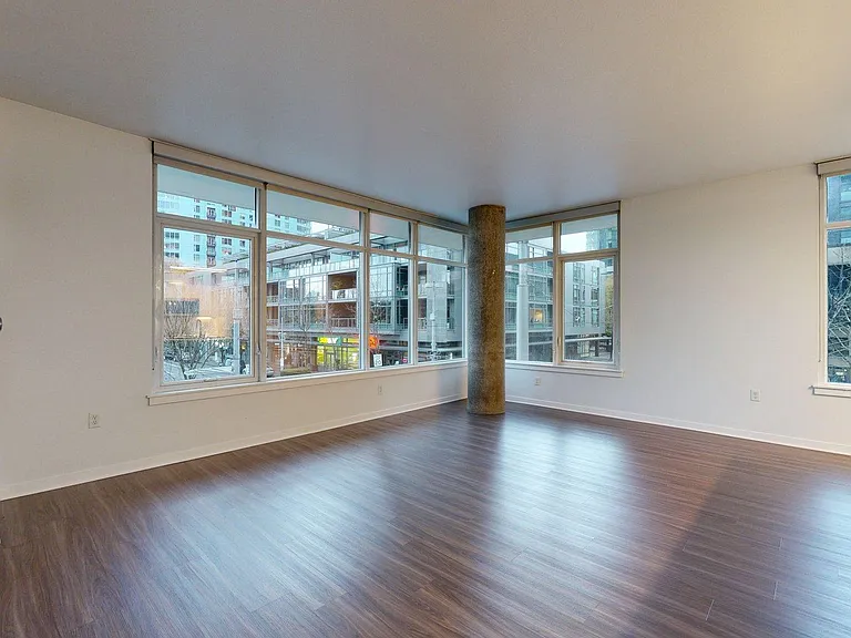Apartment living room with wood-style flooring.
