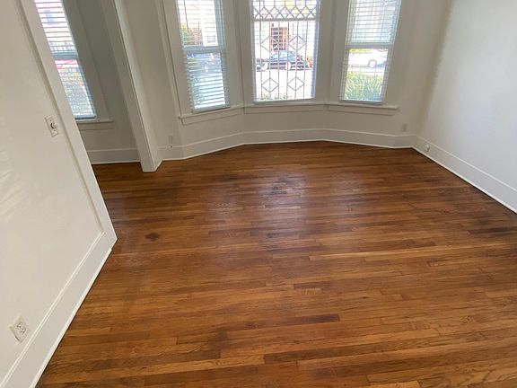 Living Room Or Dining Room With Bay and Hardwoods