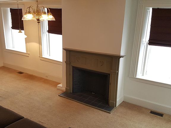 Living room/Dining/Kitchen. Non-functioning Fireplace.