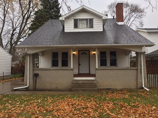 Large covered front porch. Private driveway.