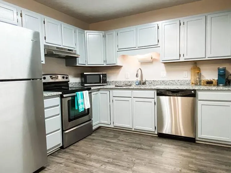 Spacious kitchen with new refrigerator
