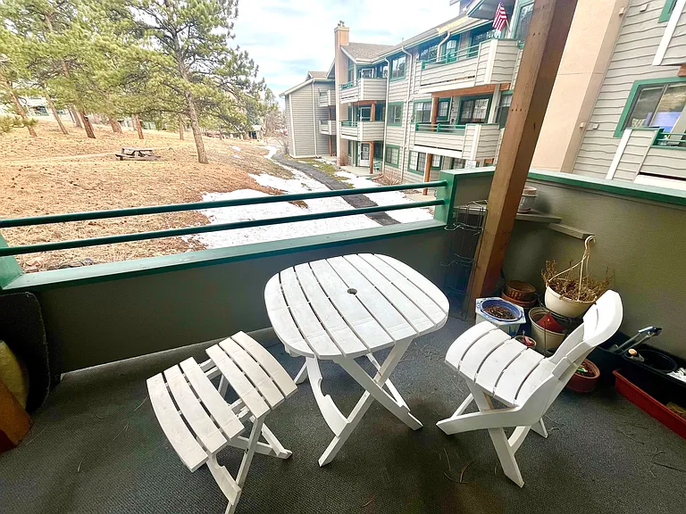 A covered outside balcony connected from the living room.