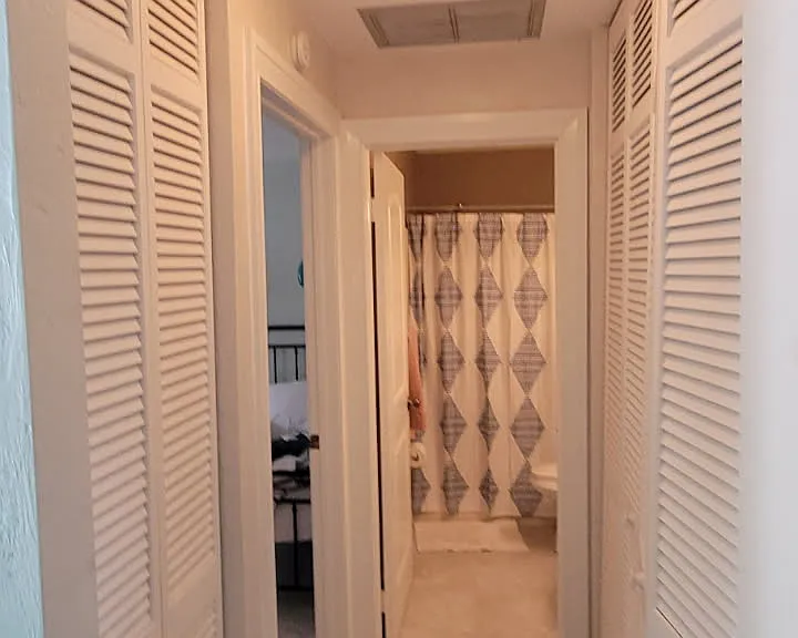 Tile Hallway to bedroom and full Bath,
Washer dryer on right
Linien closet on left