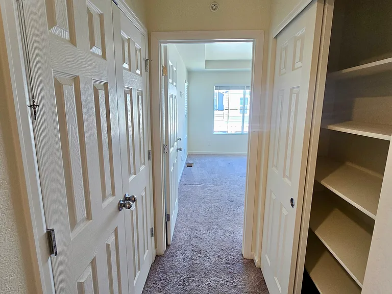 Back in the second floor hallway with linen and boiler closet. Heading to master bedroom.