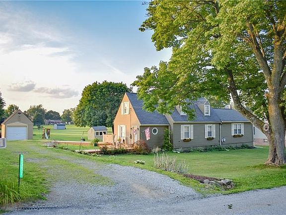 Cape Cod home offers 1.5 stories and 4 bedrooms/2 full baths, a detached 1 car garage, and even an adorable chicken coop.