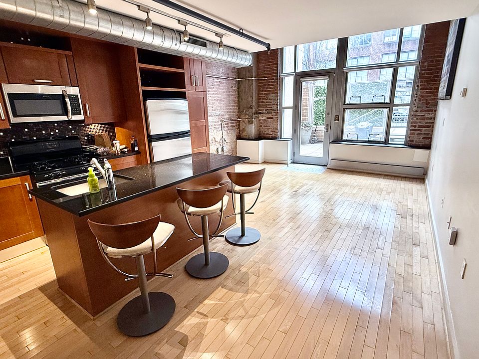 First floor with options for living room, office, bar-top dining room& full kitchen.