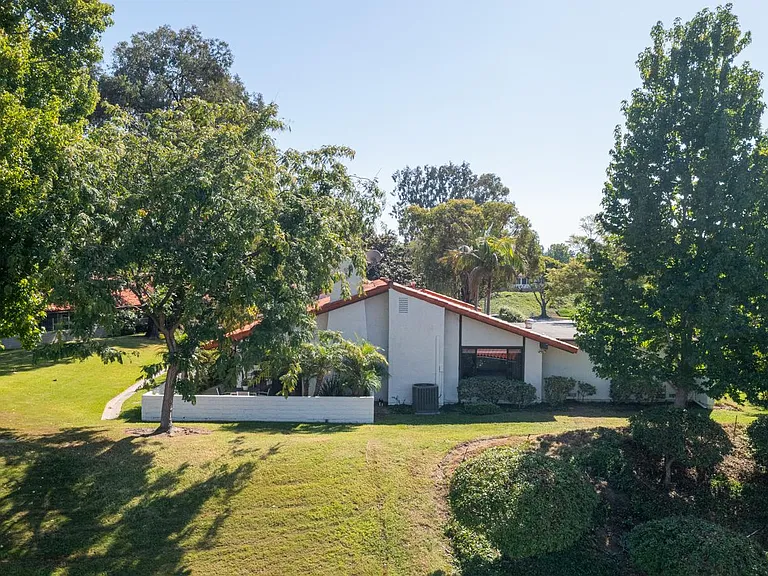 Nestled on the top of a knoll with ample space between you and your neighbors.