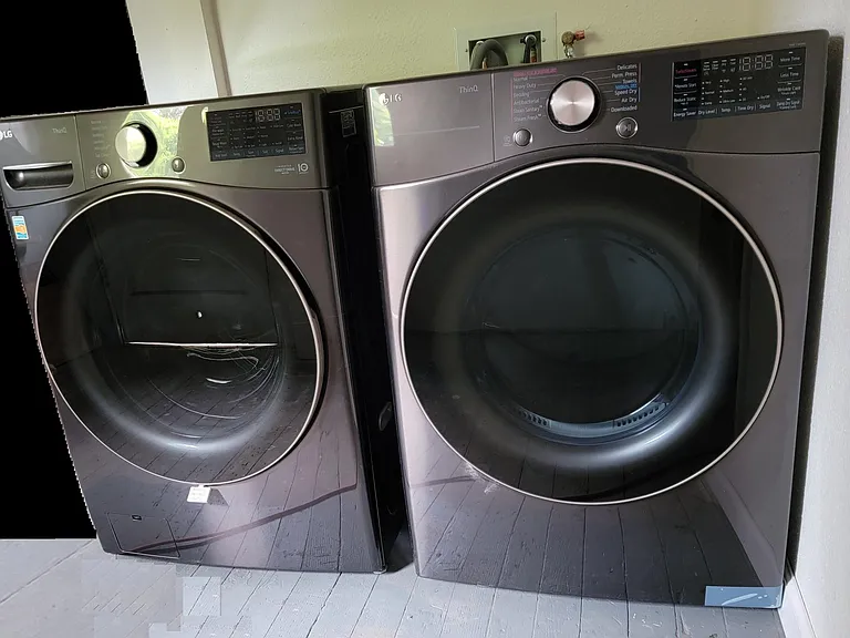 washer and dryer in basement common area