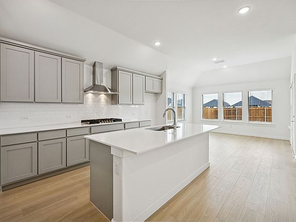 Kitchen in the Gilmour II home plan by Trophy Signature Homes - REPRESENTATIVE PHOTO