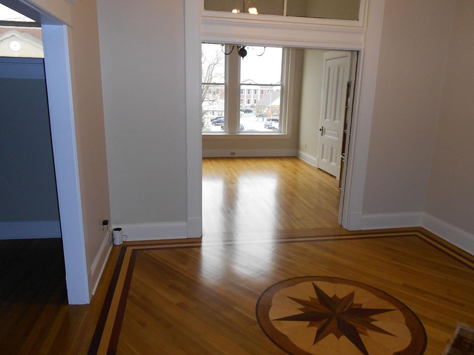Foyer leading into living room and one of the dining rooms (and pantry).