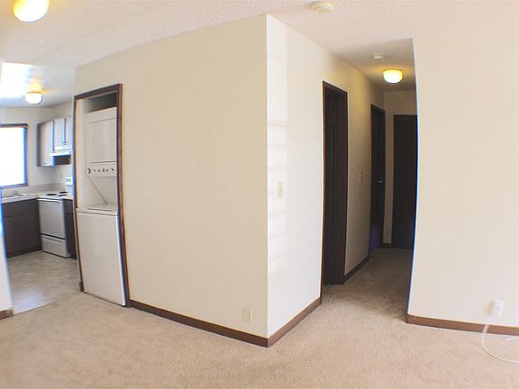 Living Area with Stacked Washer & Dryer in-unit