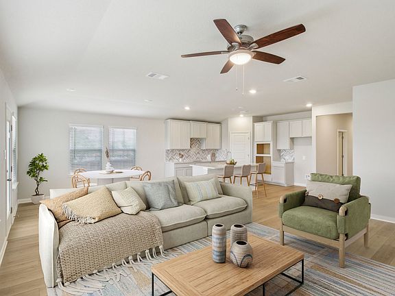 Virtually staged living room in the Preston floorplan at a Meritage Homes community.