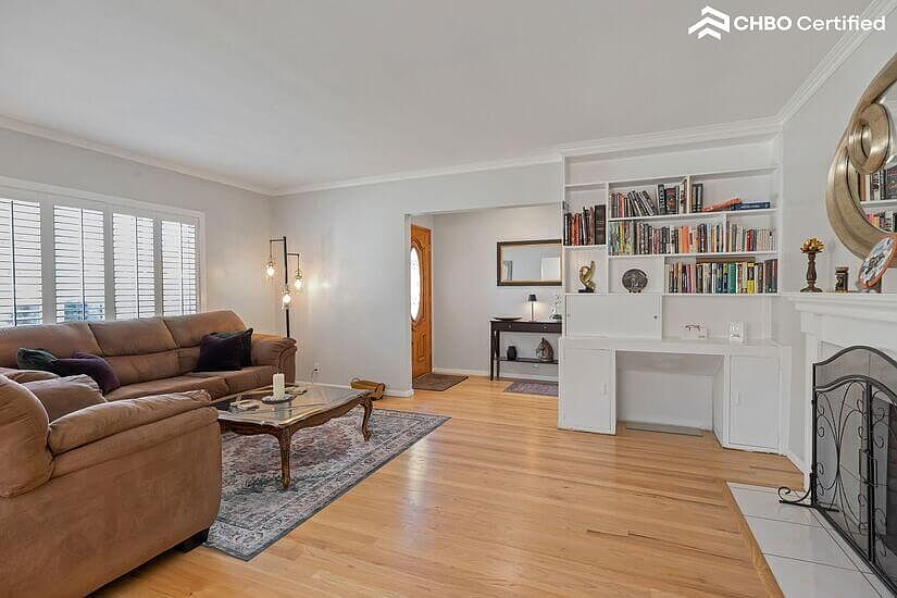 Living room showing front door and entry table