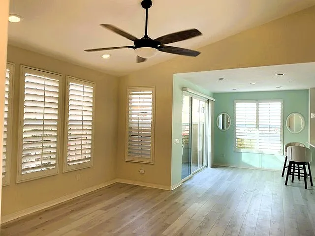 Living area toward dining area and patio