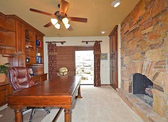 Large study with Fireplace, built-in bookcases and desk