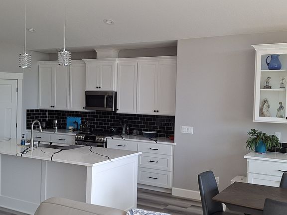 Kitchen with gas stove, pantry and plenty of counter space.
