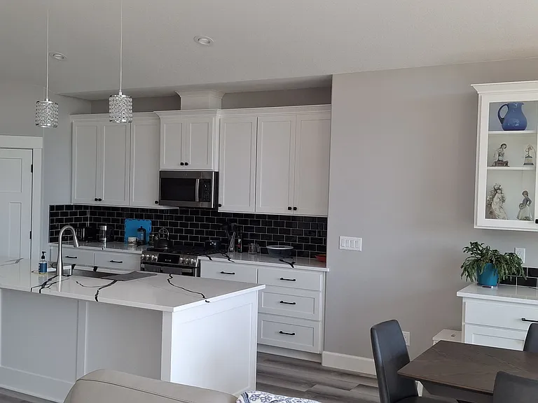 Kitchen with gas stove, pantry and plenty of counter space.