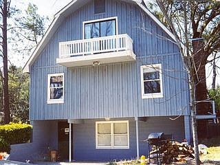 Basement leads out to patio area with huge fenced in backyard.