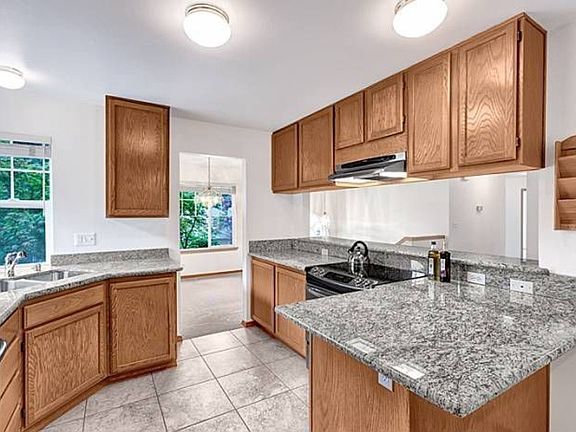 Kitchen, granite counters and SS appliances