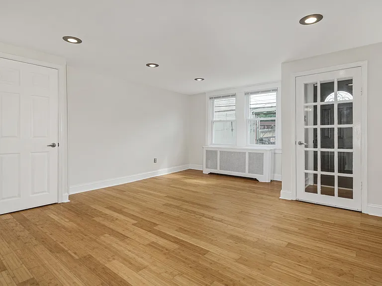 Living room facing entry vestibule