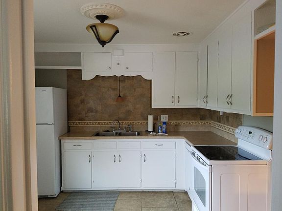 Kitchen, tile floor, dishwasher and garbage disposal