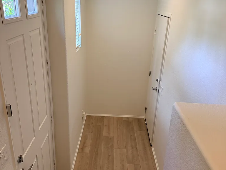 Main Entry . Attached tandem garage through the right door