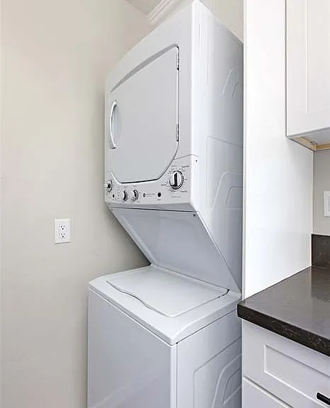 Full kitchen with gas stove and oven, washer/dryer, dishwasher, dining table for two, and everything else you would need