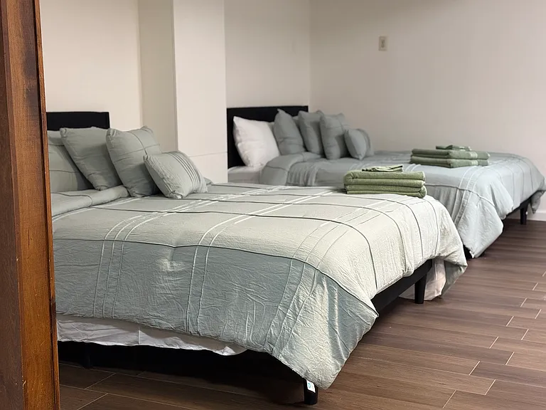 2 queen beds in the basement, with room for more.