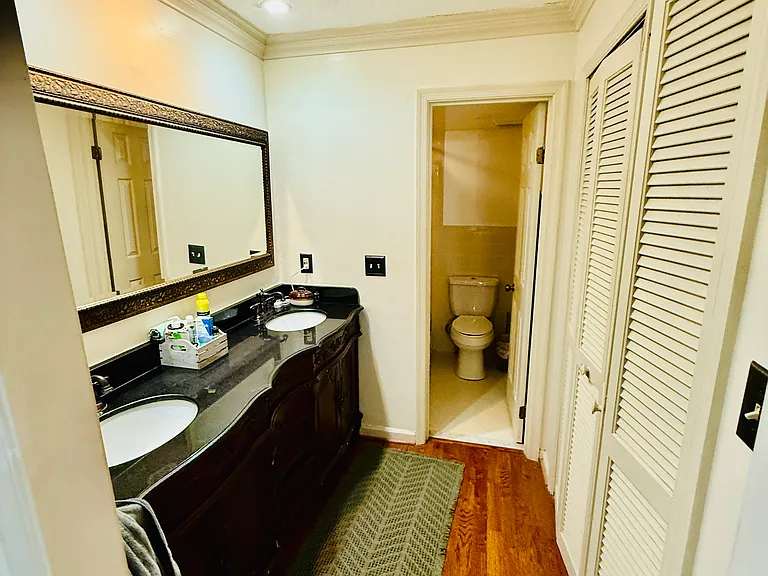 Primary bathroom. Walk in closet to the right of the double sink vanity. Shower and toilet straight back (with privacy door)
