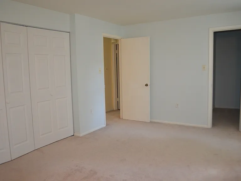 Bedroom, with closets and a view to the walking closet