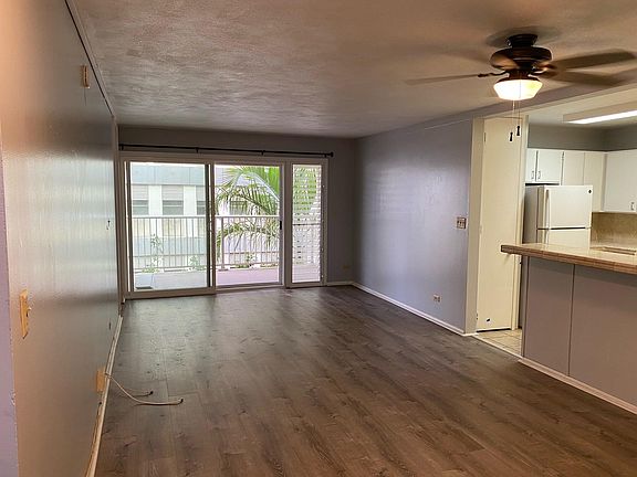 Living area with sliding glass door and lanai