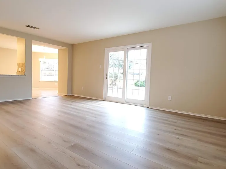Living room opens to the back yard and kitchen breakfast area. Very spacious