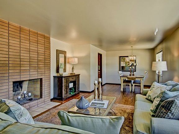 Living room flows into dining.   Hardwoods in this room, hall an