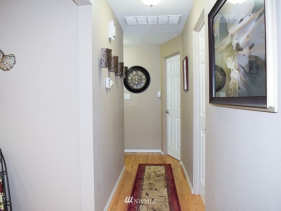 Hallway to Bedrooms The hardwood floors are original and have been redone   Also all new doors thru out.