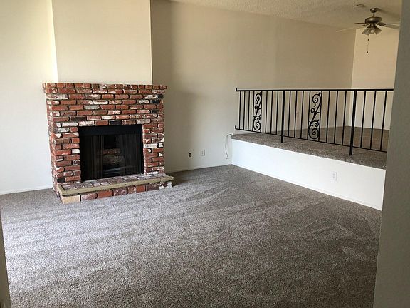 Living room with decorative fireplace