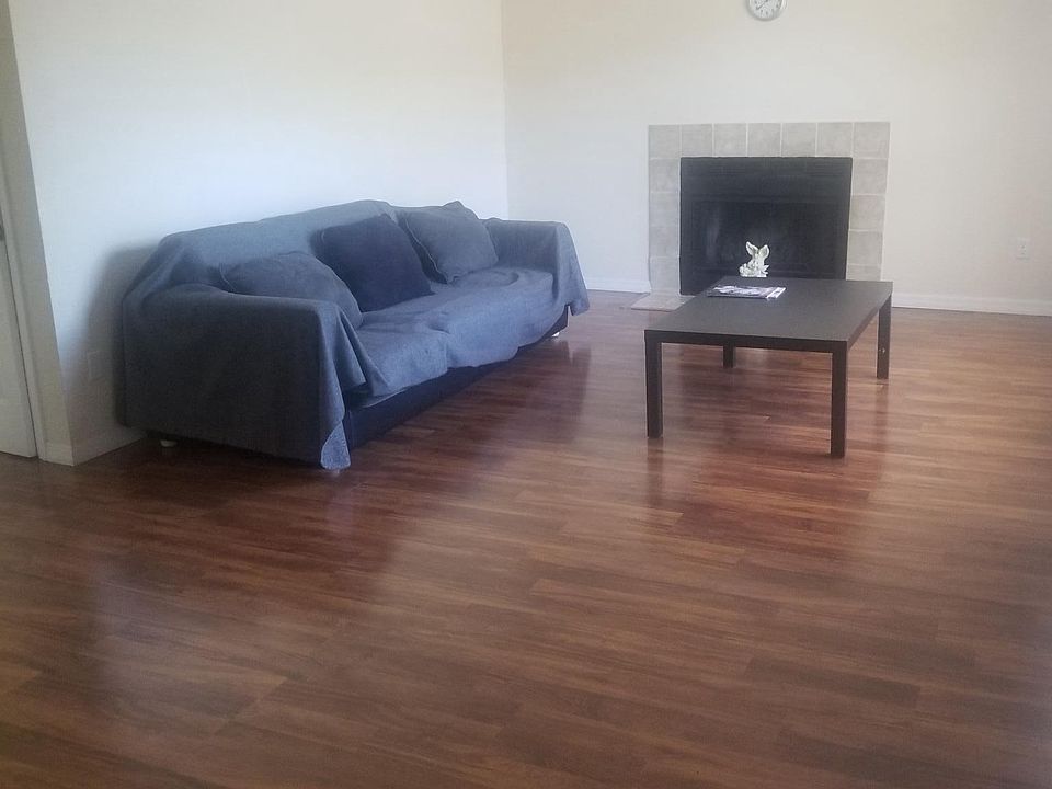 Living area with vaulted ceilings and fireplace