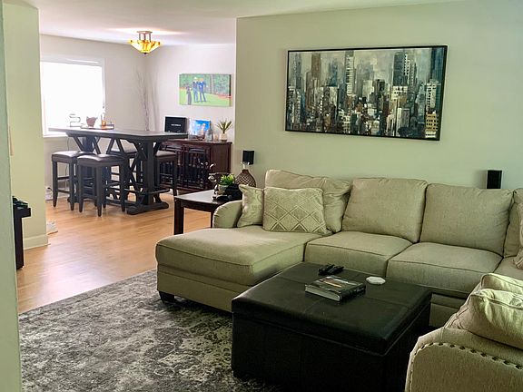 Other side of living room into dining room (furnishings of previous tenant)