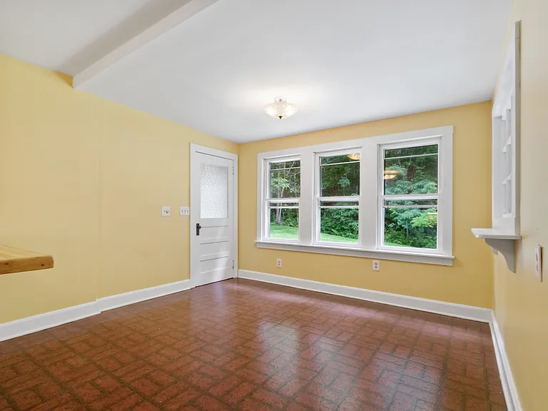 Sunny dining area next to kitchen.