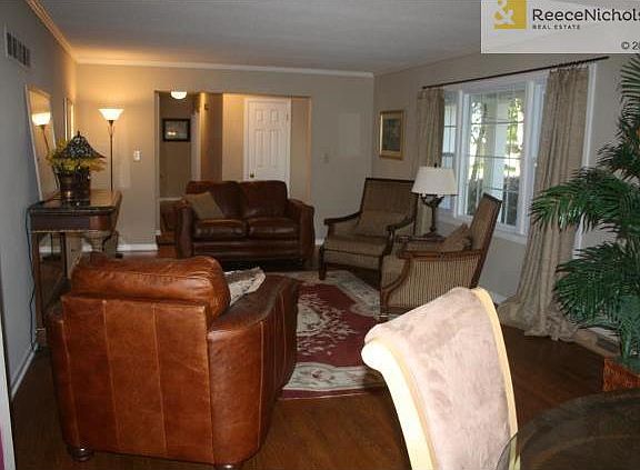 Spacious living room with newer windows.