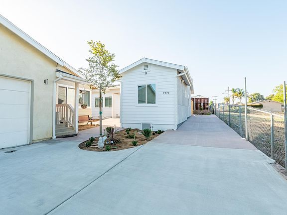BRAND NEW MODERN MINIMALIST SINGLE FAMILY HOME with carport on the right for up to 3 cars