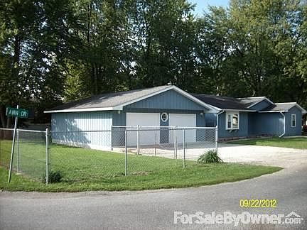 Exterior view with garage
						:
						east and part of south portion of the property are fenced in