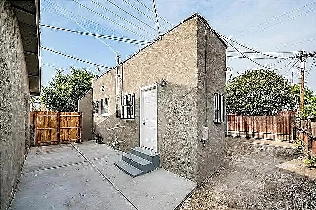 Fully fenced side yard with private outdoor patio space.