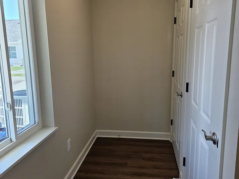 Additional entrance space with laundry closet and mechanical room.