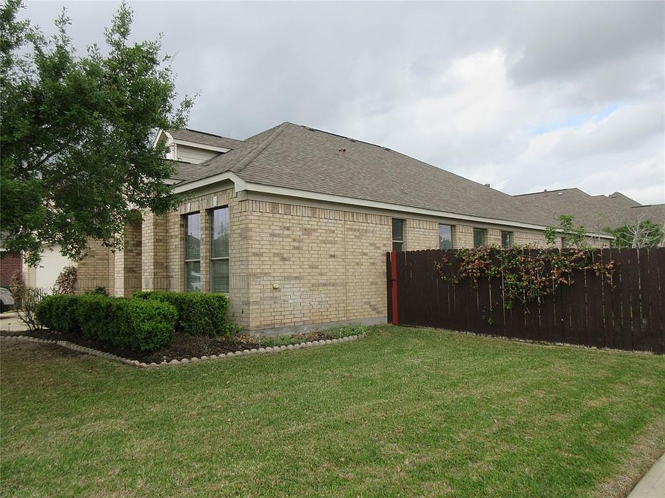 This beauty has a brick exterior and sits on a large corner lot. The house faces south.
