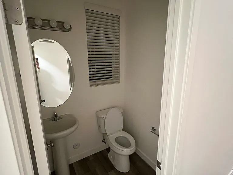 Half bath located on the main floor next to the laundry room.