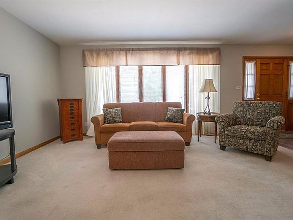 VIEW OF FORAL LIVING ROOM & TILED FOYER!