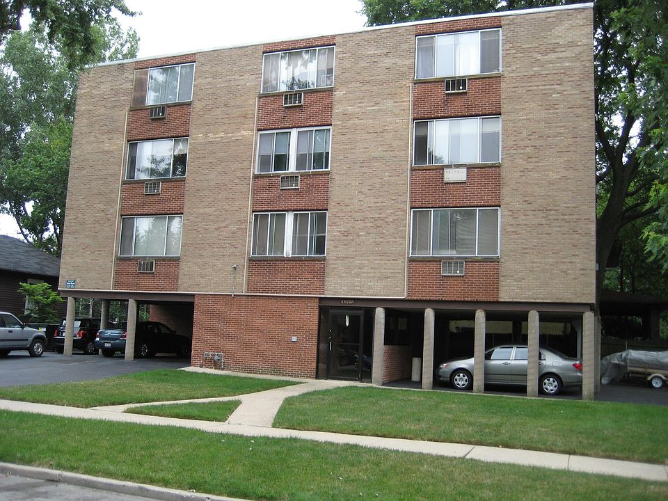 Looking south from Crain Street. The living room of the apartment is on the left in the middle row.