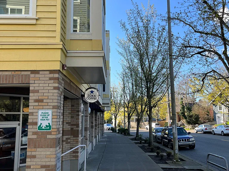 Quiet neighborhood street. Zoka coffee on floor 2.